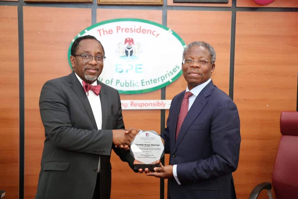 Professor Fabian Ajogwu presenting aplaque to Mr Ayodeji Ariyo Gbeleyi