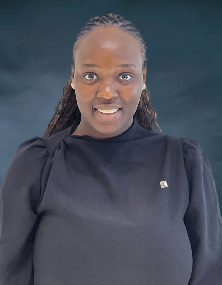 Smiling dark skinned woman with braided hair and ear rings