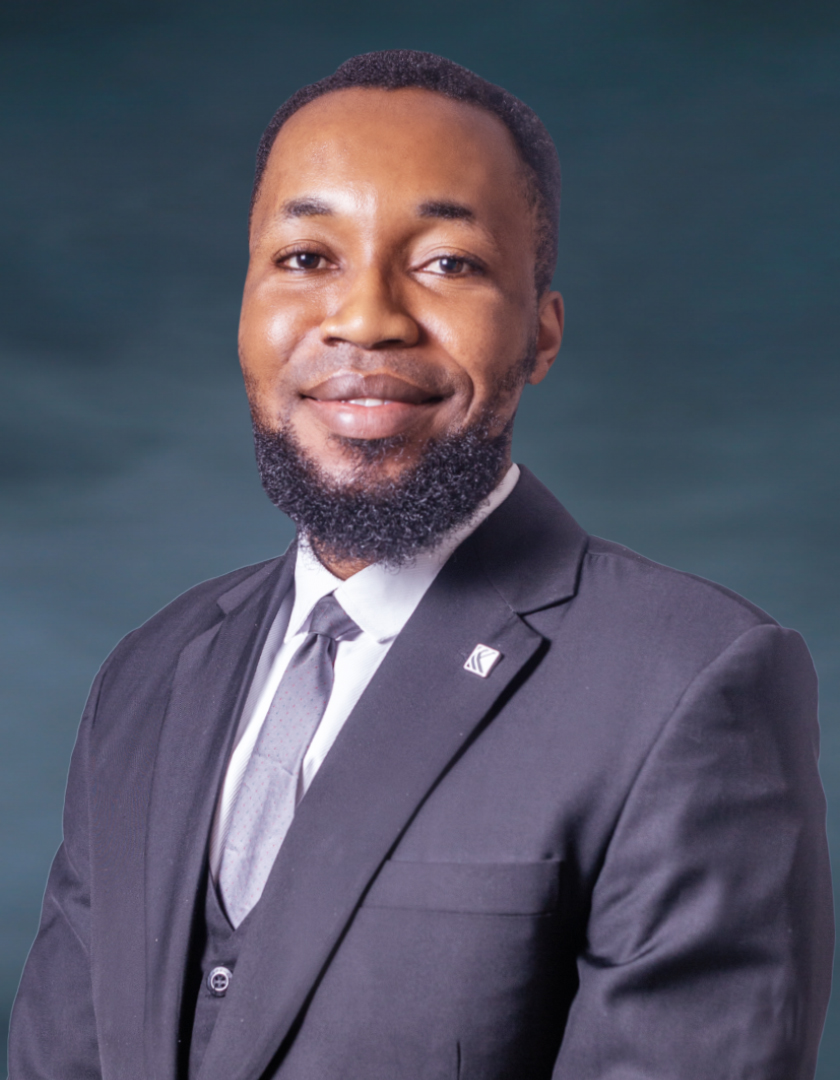 Smiling light-skinned African man in a three-piece suit