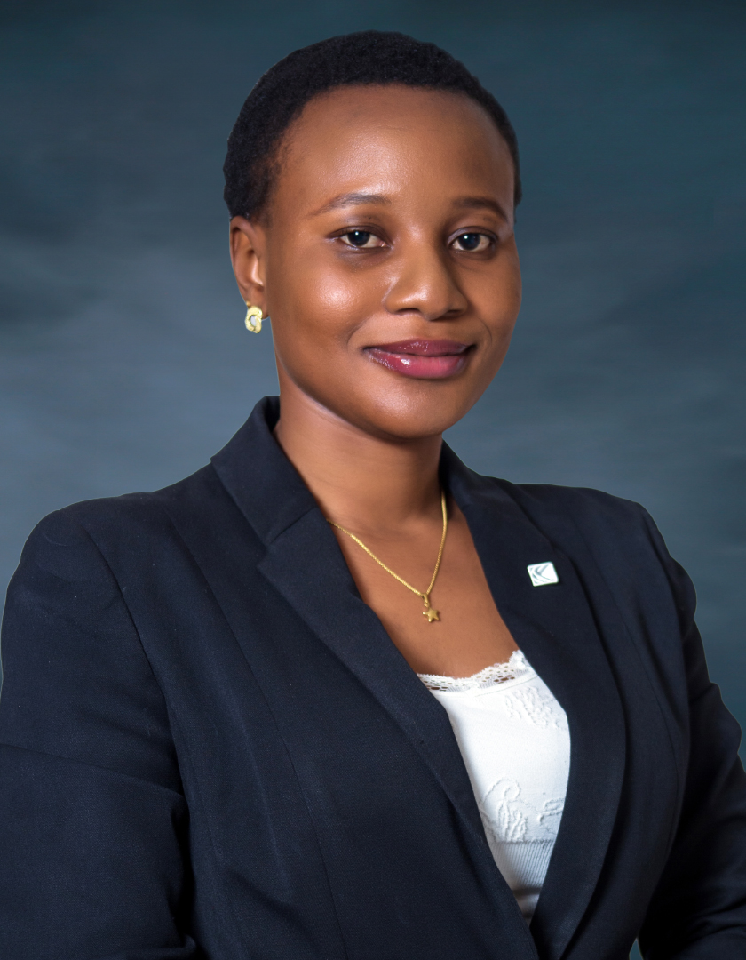 Smiling light-skinned African woman in a white blouse and black jacket