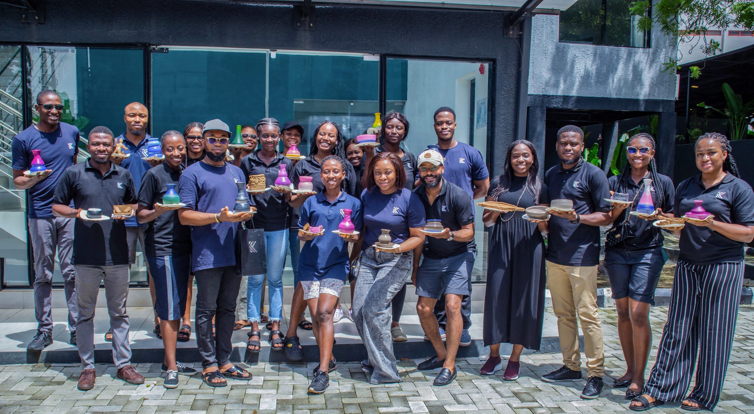 Kenna Partners staff members with their creations after the pottery workshop