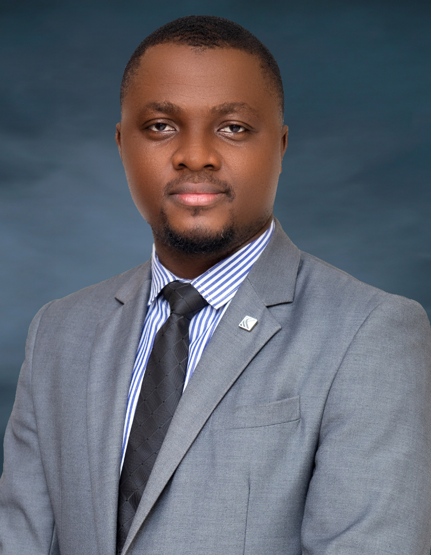 Dark skinned African man in a grey jacket, stripped white and blue shirt with a black tie