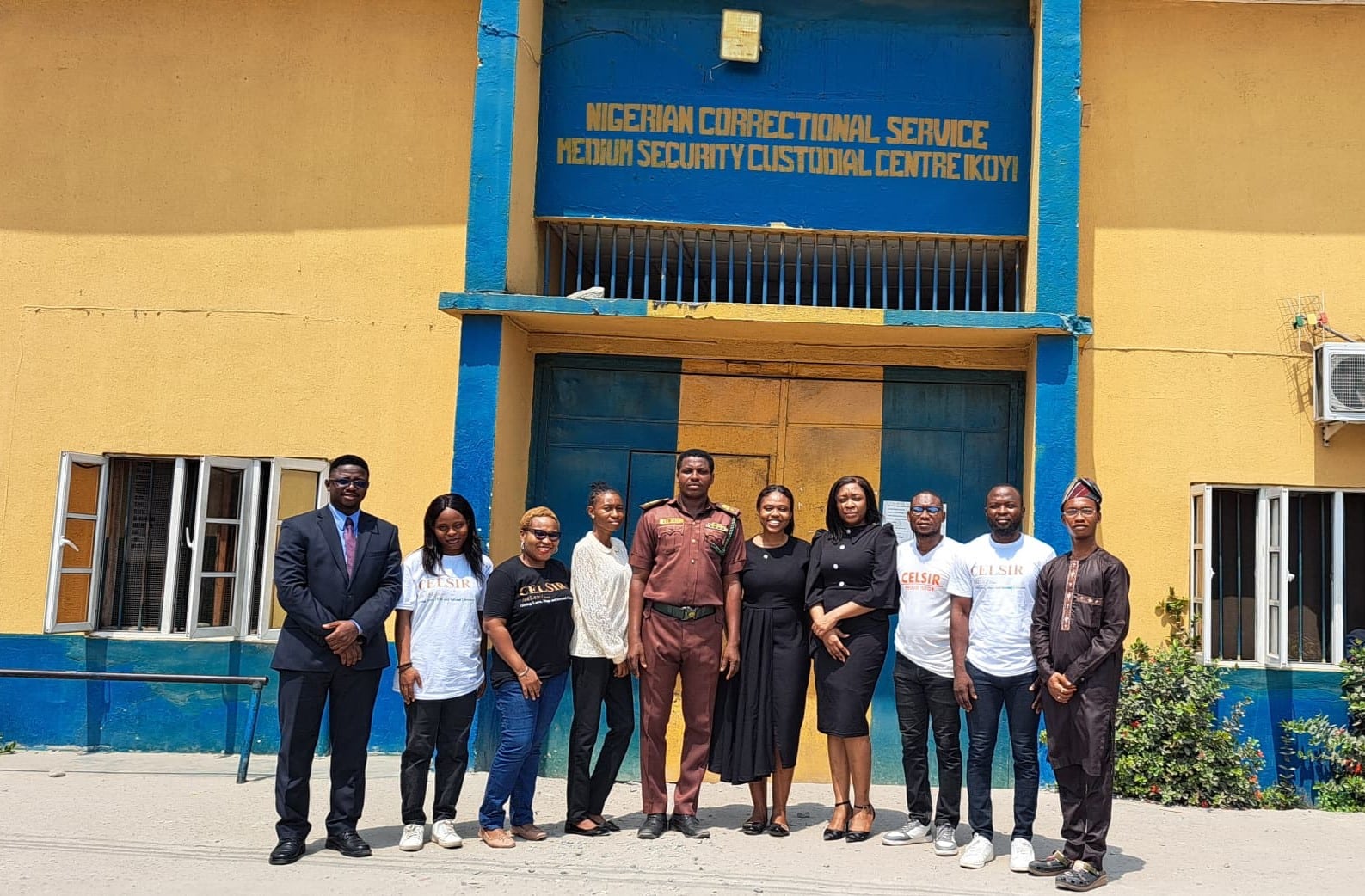 10 individuals in front of the entrance of the Ikoyi Medium Security Correctional Centre