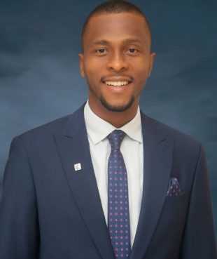 Smiling African man in corporate attire and dark blue tie